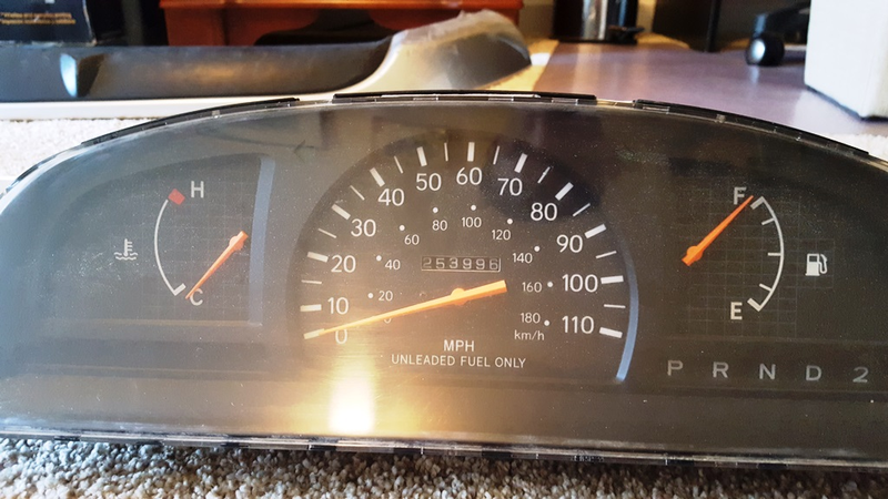 The original gauge cluster and the correct mileage of 253,996 miles.